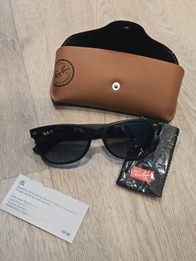 Ray-Ban Black Frame Sunglasses with Dark Lenses